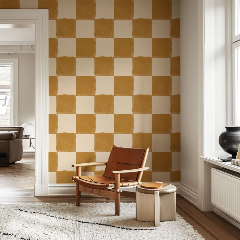 Warm checked wallpaper behind a timber chair