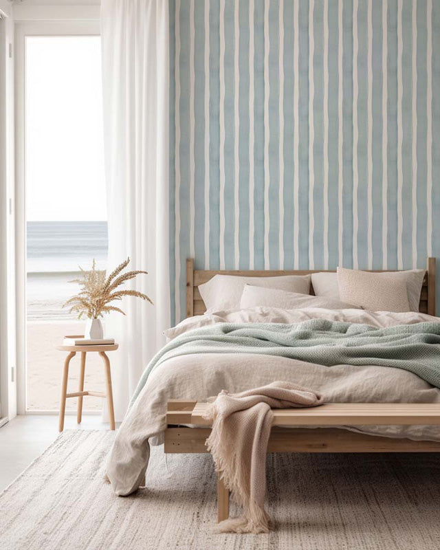 Hand-painted stripe wallpaper in a coastal bedroom