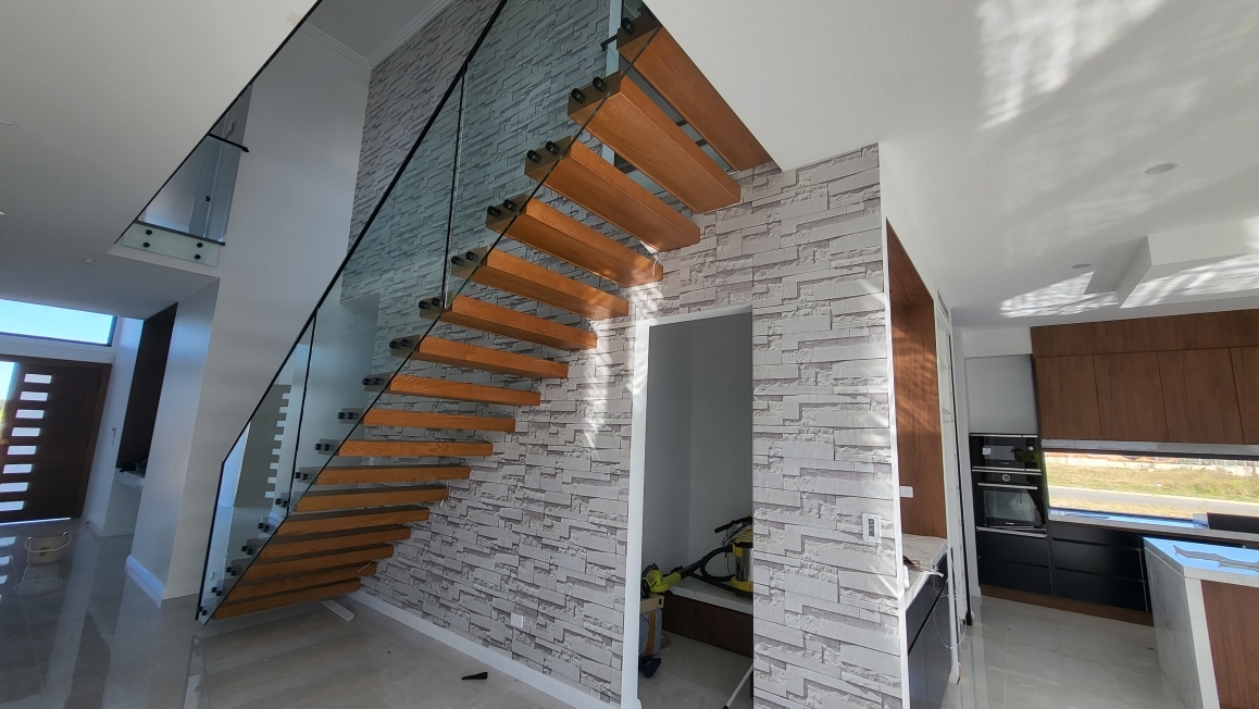 Staircase feature wall wallpaper installed by Wallpaper Masters Sydney